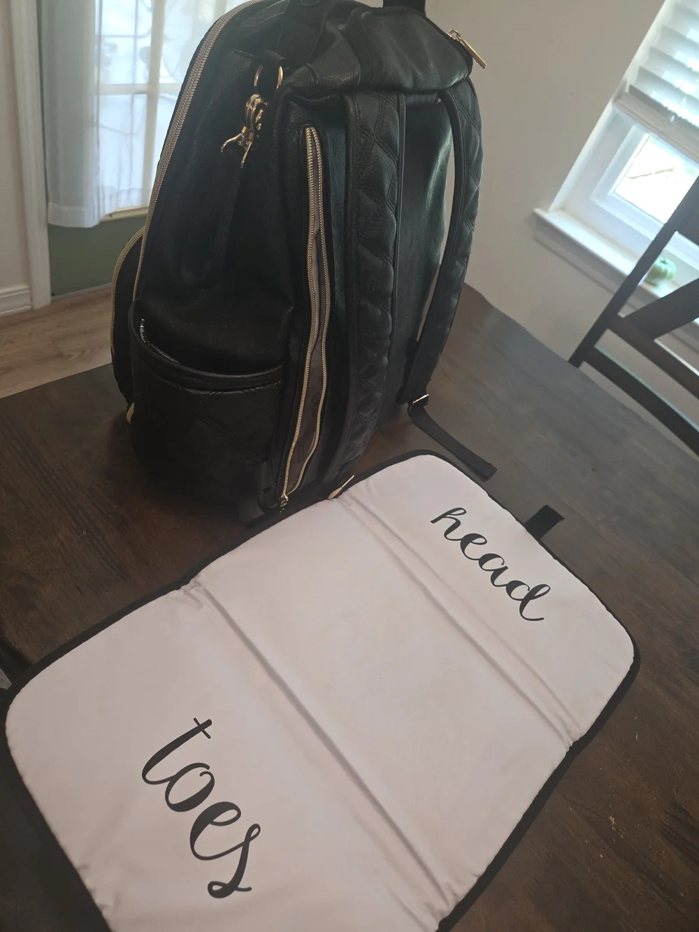 Itzy Ritzy Black Quilted Backpack Diaper Bag with Gold Hardware